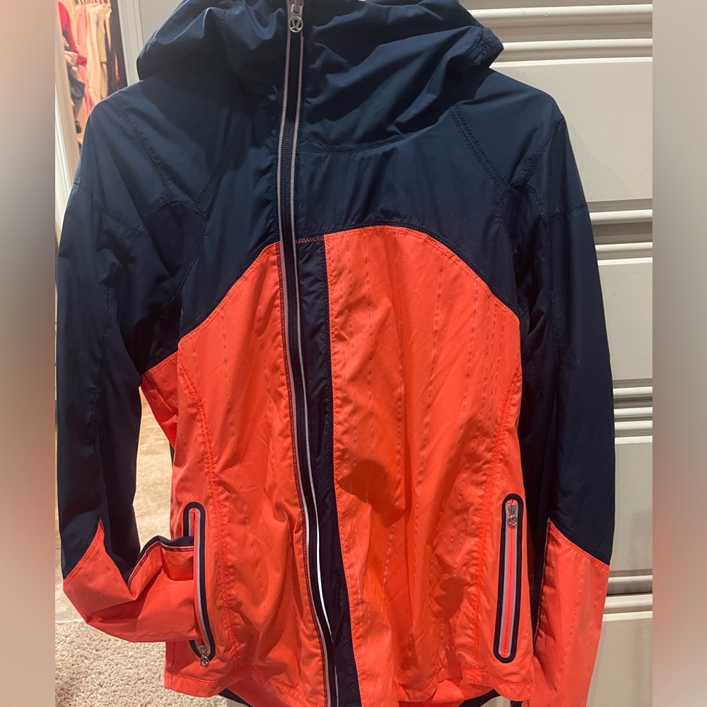 Lululemon Wind Breaker Jacket Size 8
Hood allows for ponytail (pic)
Zip pockets